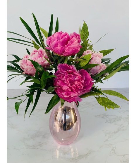 pink peonies in mirrored glass vase